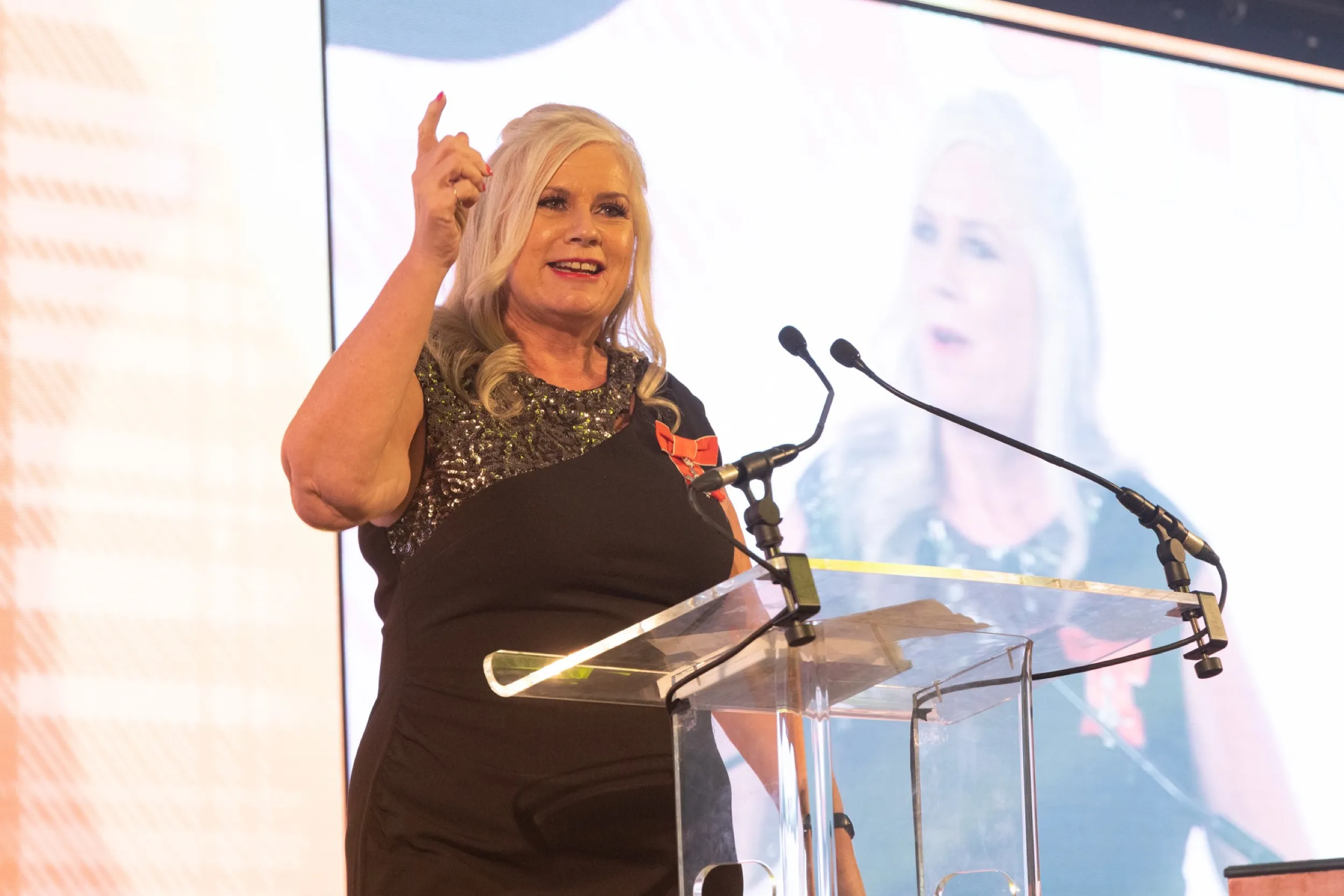 Dr Alison Edgar MBE on the podium at the Beatson Cancer Charity gala in Glasgow.