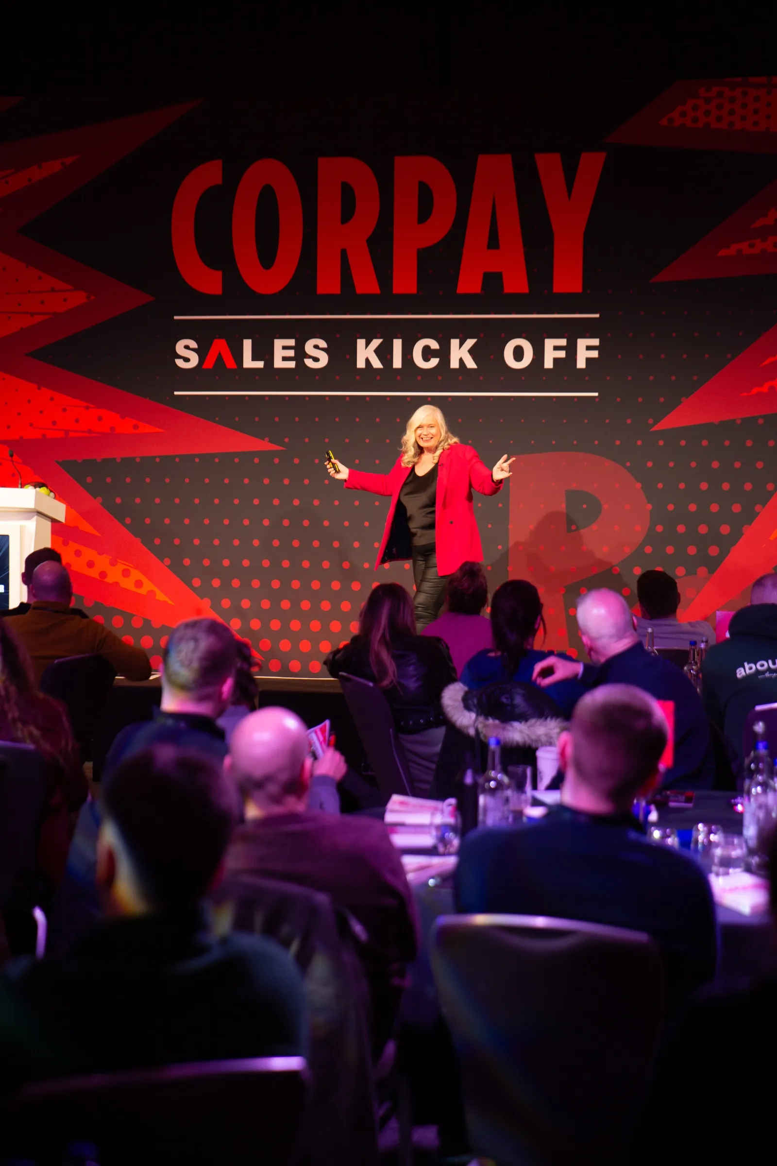 Dr Alison Edgar MBE on stage at Corpay's sales kick-off.